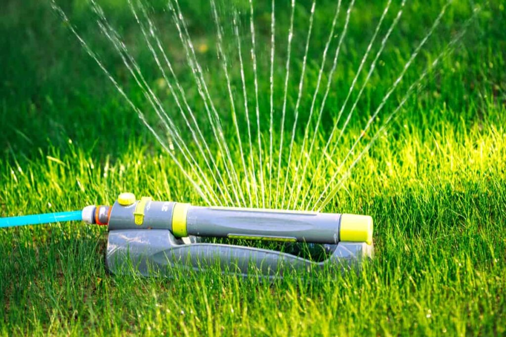 Modern sprinkler working on grass irrigation