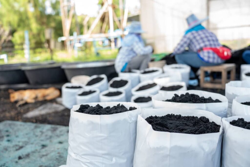 Preparing the Soil for Planting in A White Bag